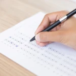closeup-person-filling-out-questionary-form